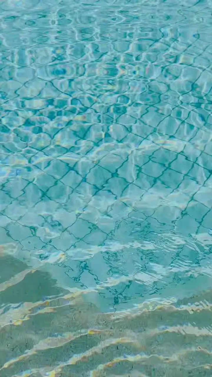 A floating breakfast tray on the surface of the pool