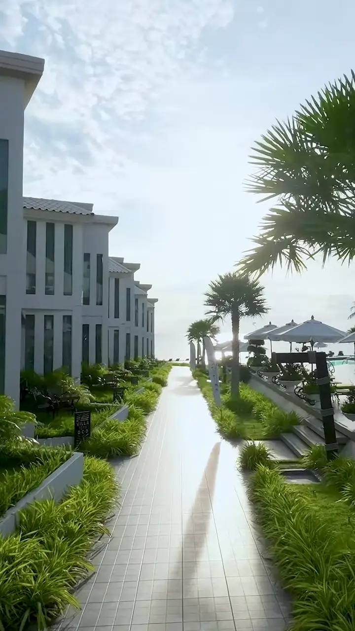 Garden path running between the villas down to the sea